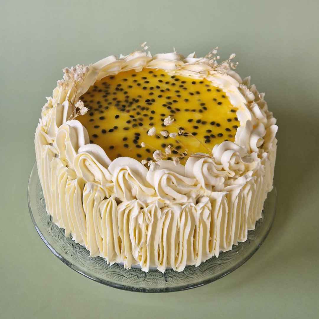 Passievrucht witte chocolade taart (8 pers)